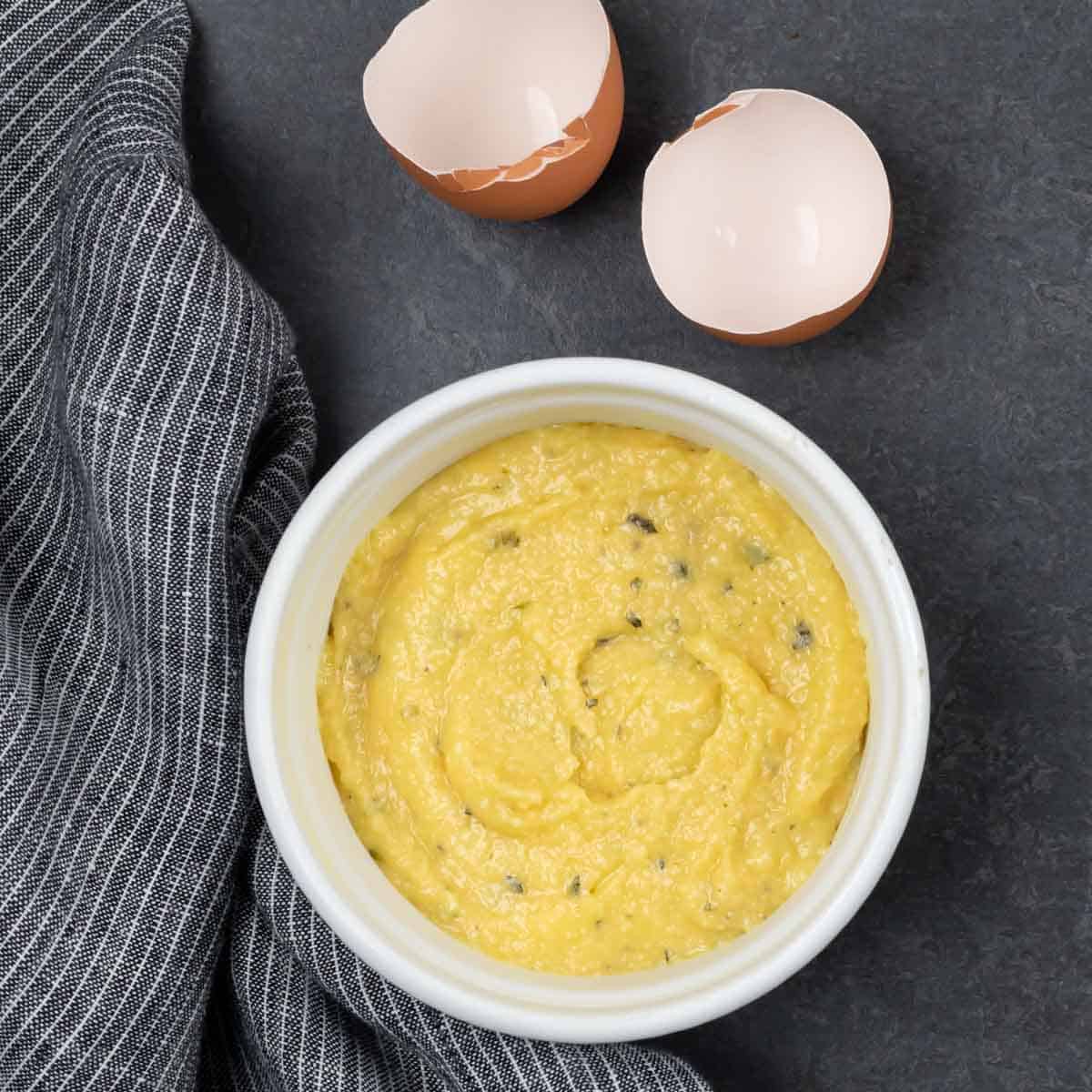 Bread batter poured into ramekin ready to cook.