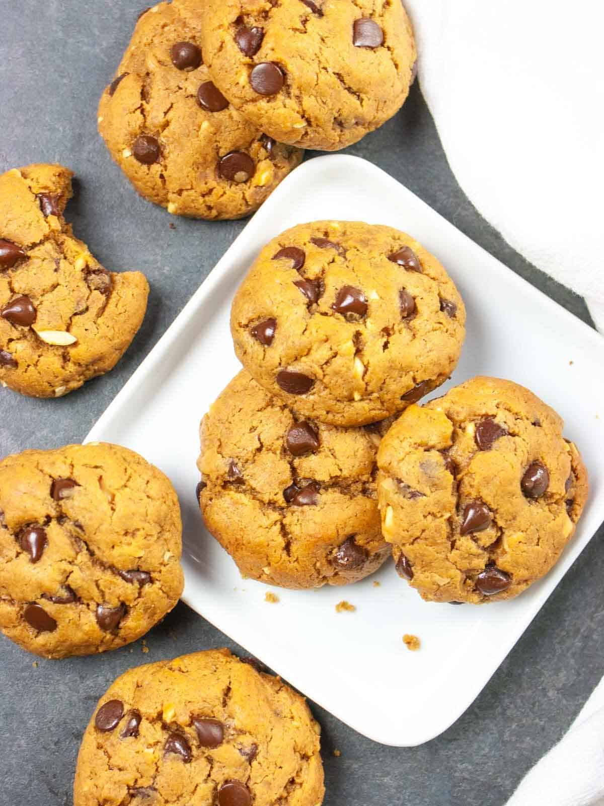 Keto flourless chocolate cookies on a white plate on a gray background with a white napkin.