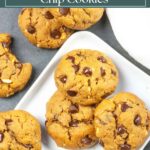 Flourless chocolate chip peanut butter cookies on a white plate on a gray background with a white napkin.