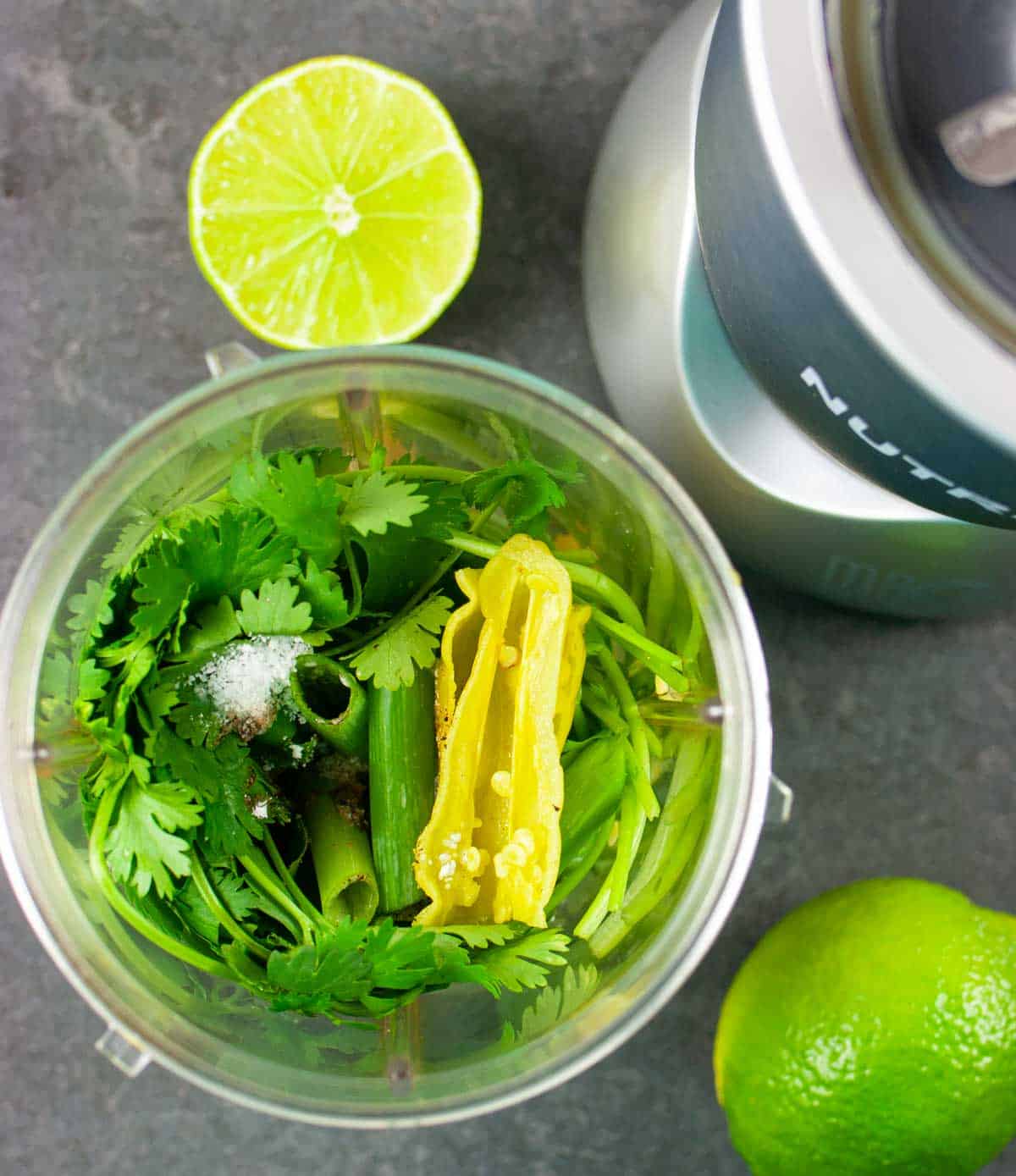 Dressing ingredients piled in a nutribullet blender ready to blend.