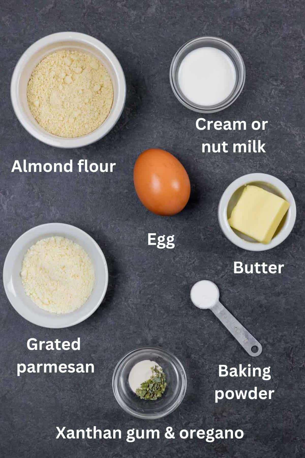 Labelled ingredients in small white bowls.