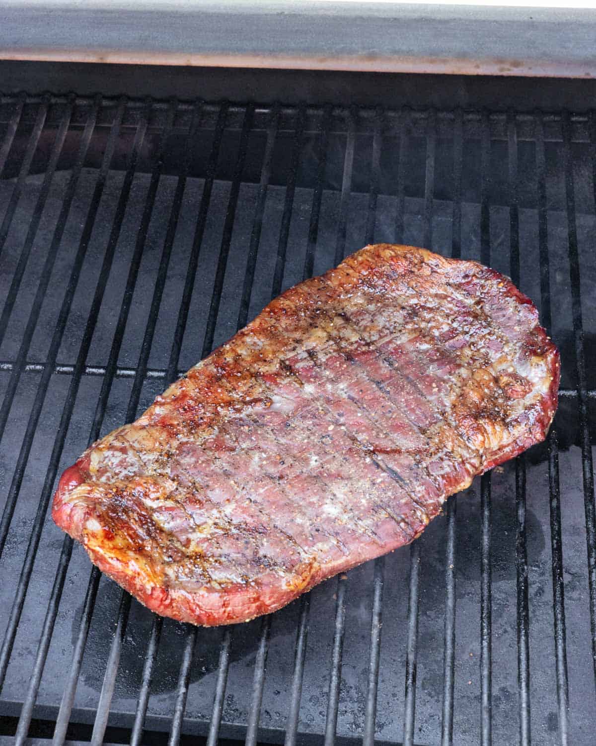 Flank steak flipped on the smoker for searing side 2.