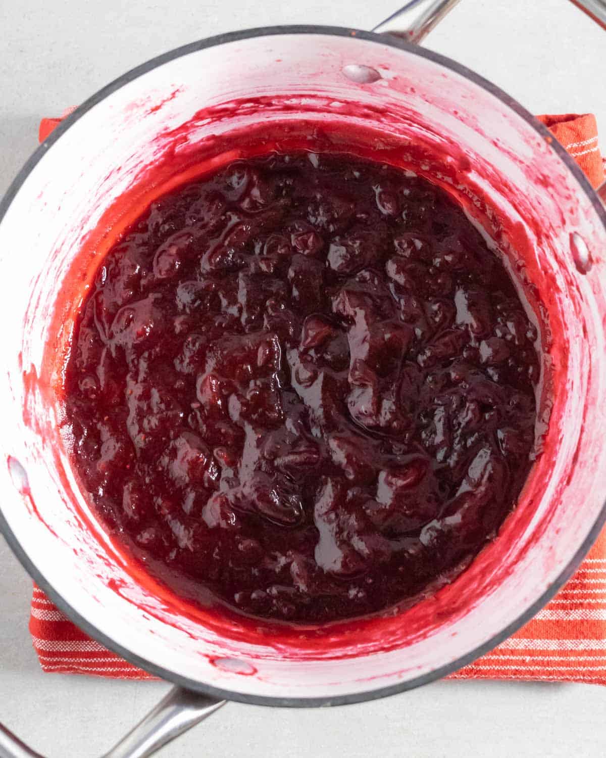 Pot of cooked cranberry jam.