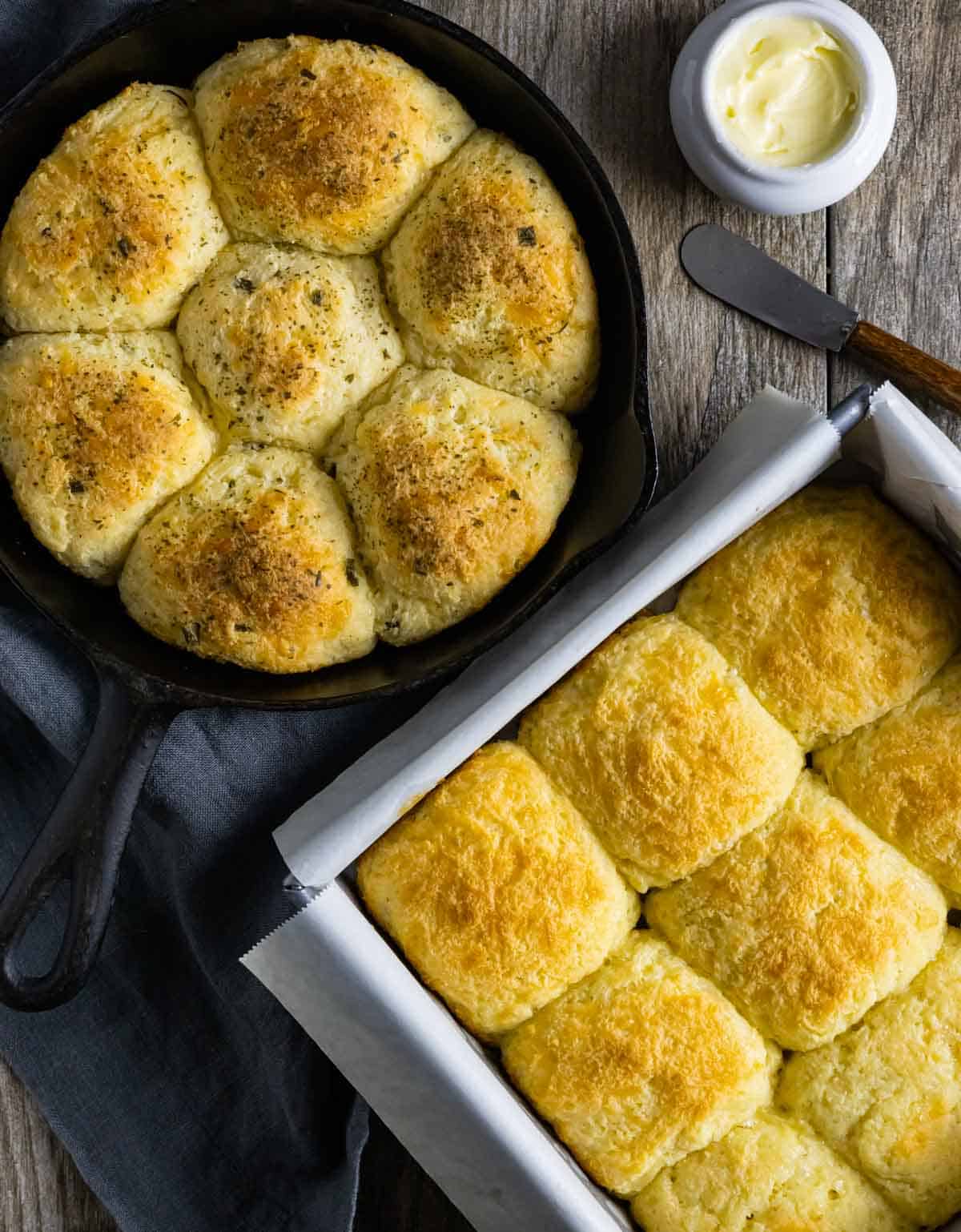 Baked rolls in cast iron and square baking pan.