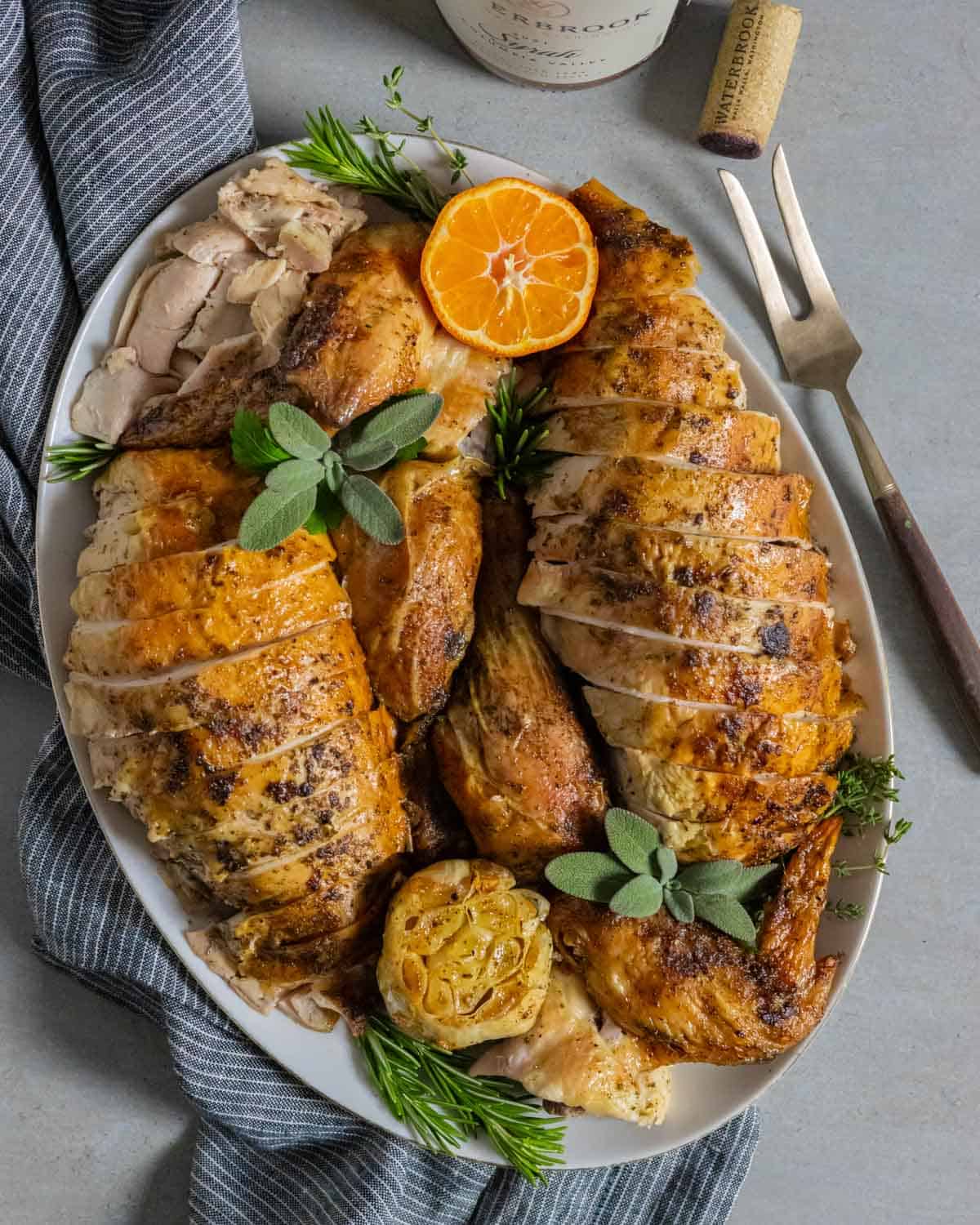Sliced roasted chicken on a platter ready to serve.