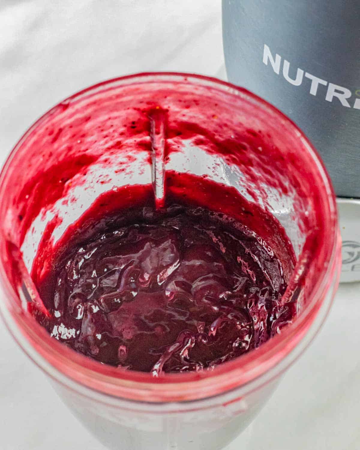 Blueberry bbq sauce blended smooth in a Nutribullet blender cup.