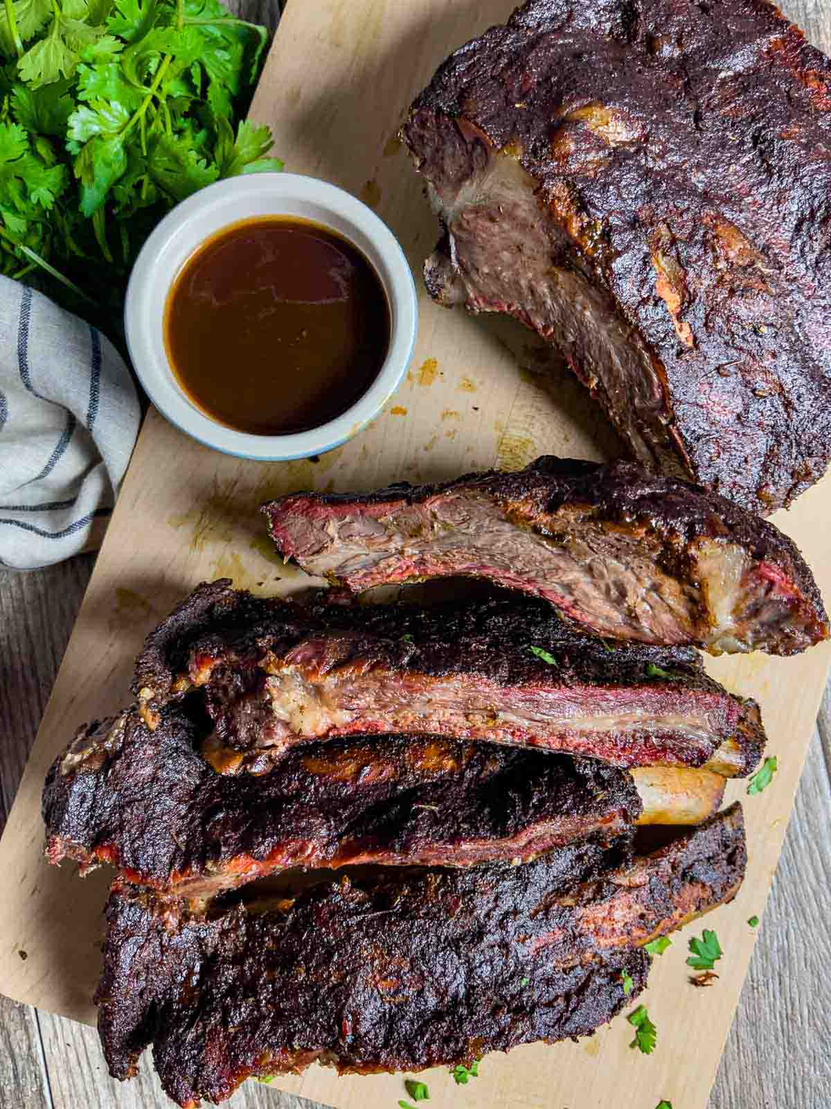 Rack of sliced smoked beef ribs coated in low-fodmap barbecue rub and sauce.