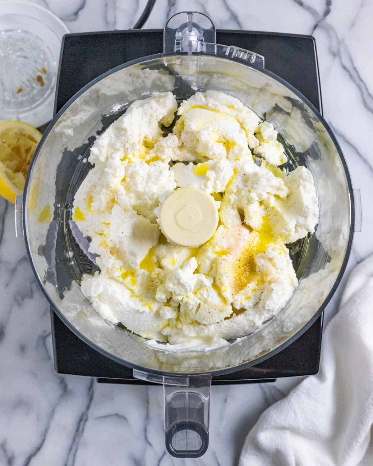 Ricotta party dip ingredients in a food processor bowl ready to mix.