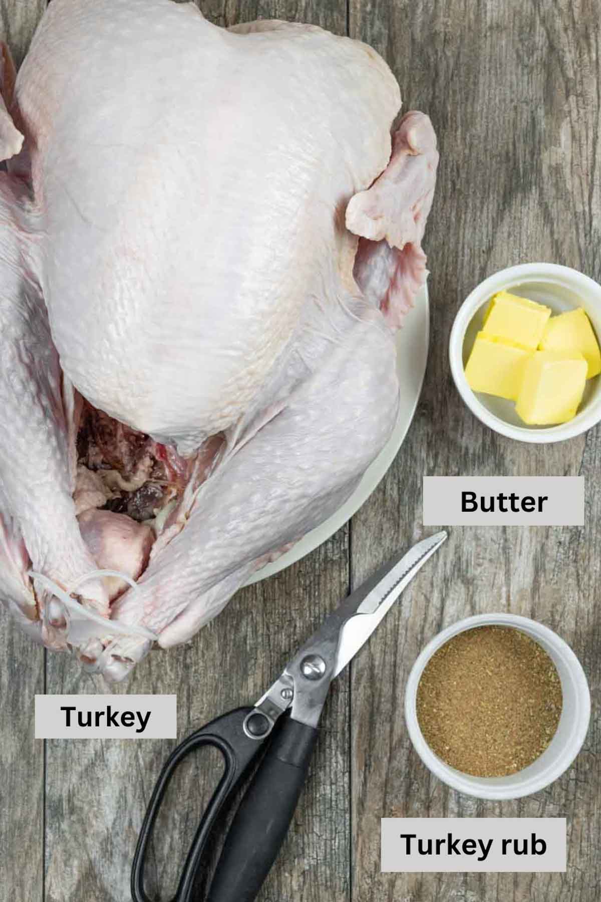 Ingredients for spatchcocked turkey with shears with black text labels.