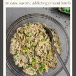 Bowl of miso tuna salad with a serving spoon in it on a grey board with a small bowl of black and white sesame seeds.