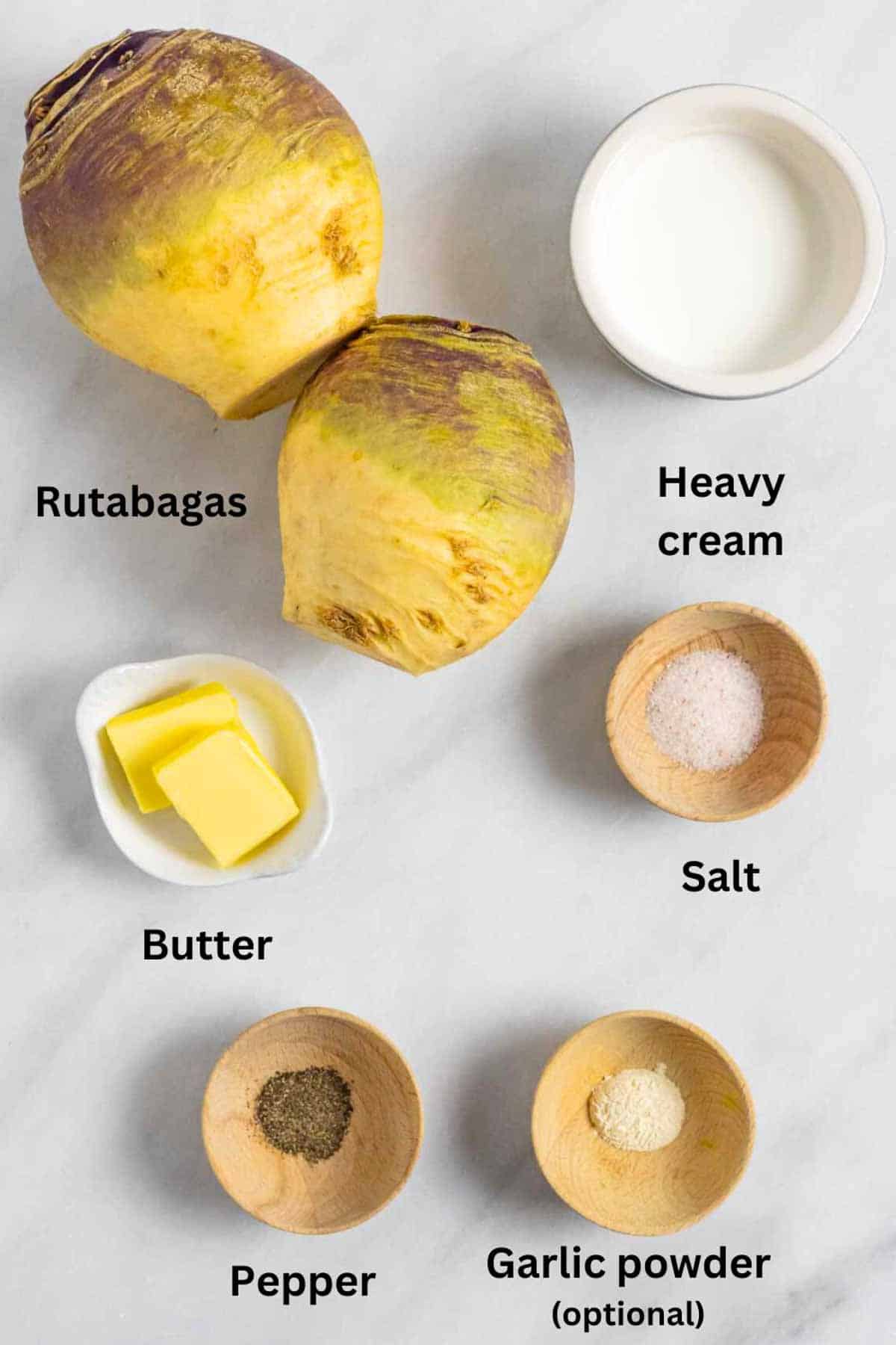 Ingredients for rutabaga puree on a marble board with black text labels.