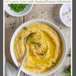 Rutabaga puree in a white bowl with a spoon and sprinkled with herbs.