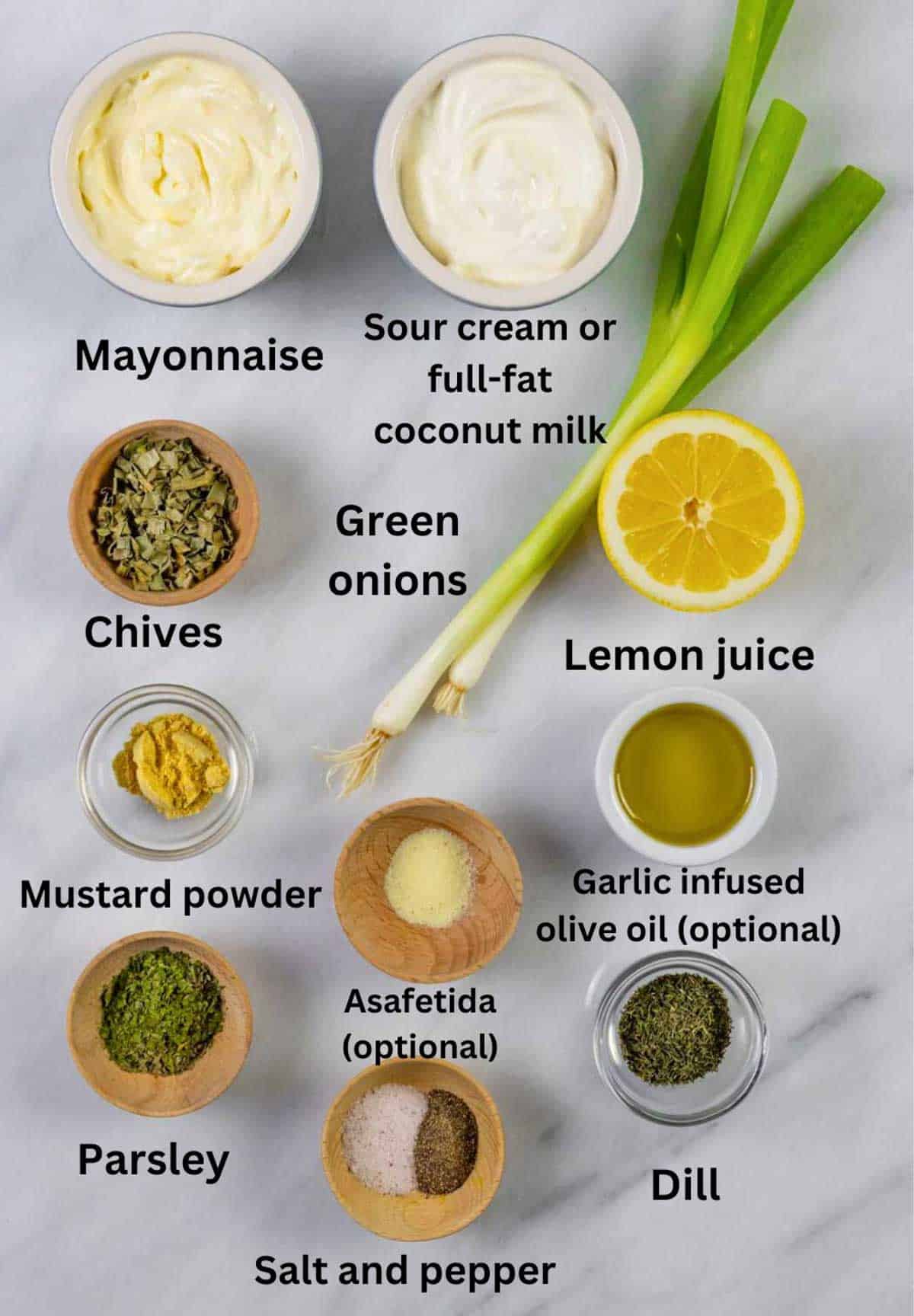 Ingredients for low-fodmap ranch dressing and dip on a board with black text labels.