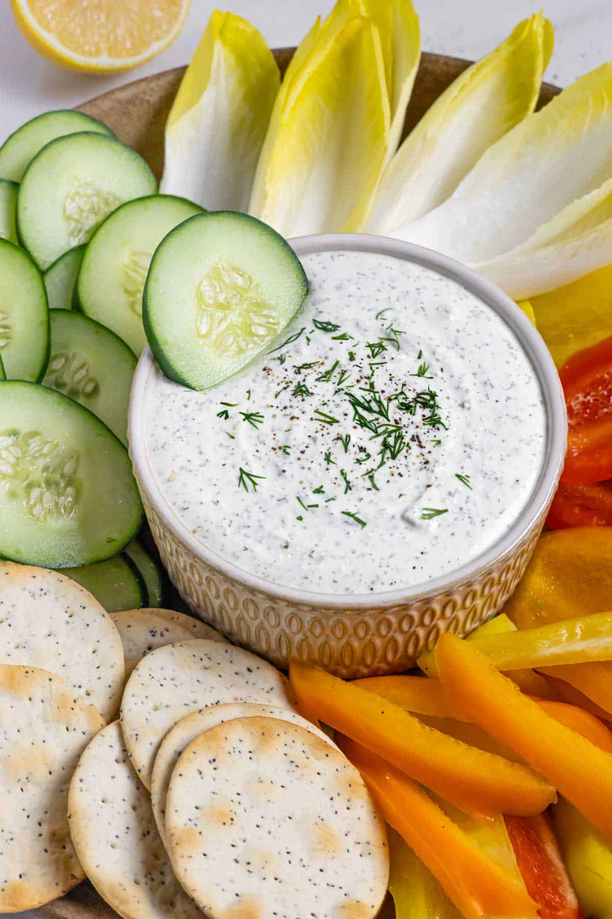 Cottage cheese ranch dressing in a small bowl with vegetables on the side.