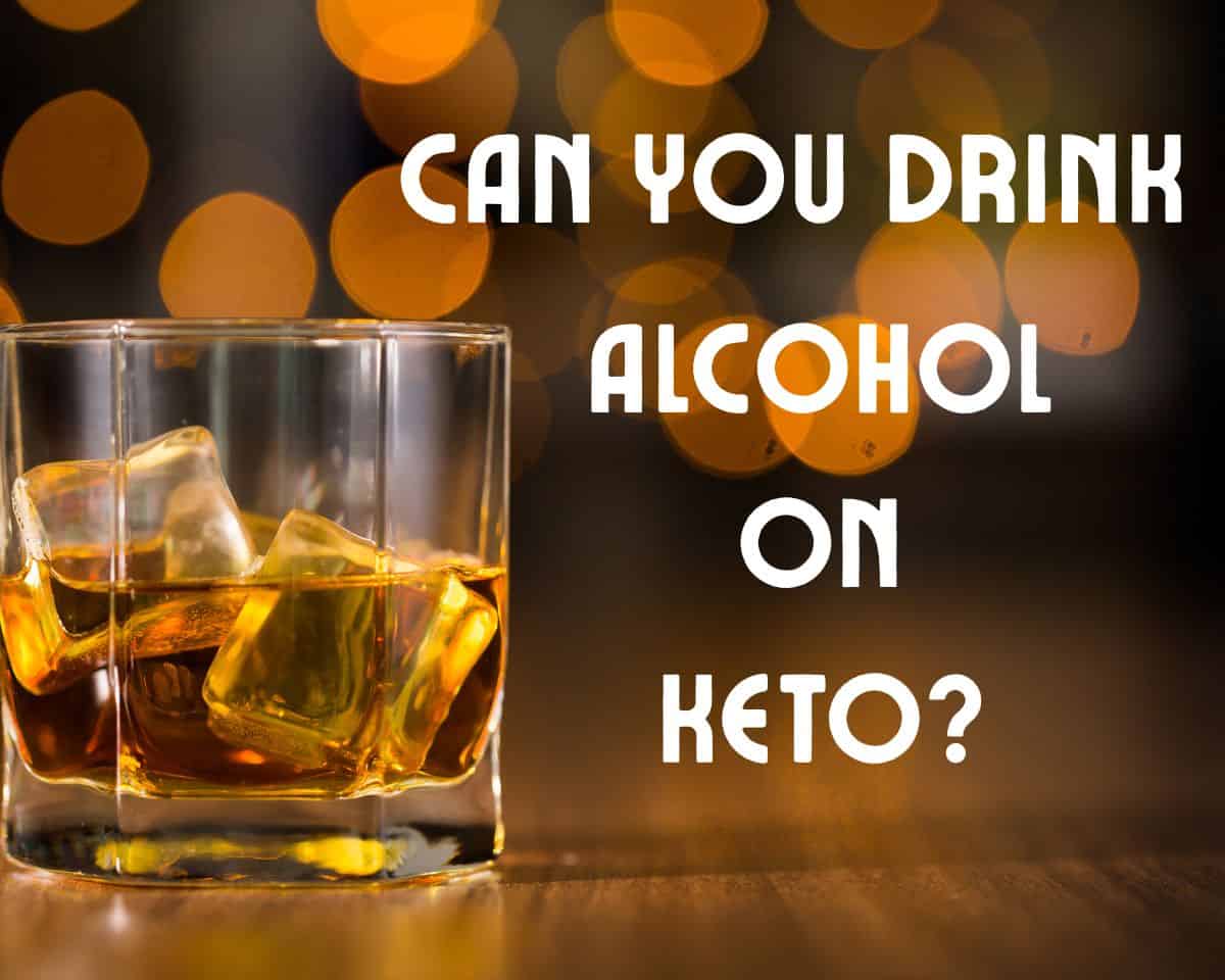 Dark spirit in glass with ice cubes with title can you drink alcohol on keto to the right