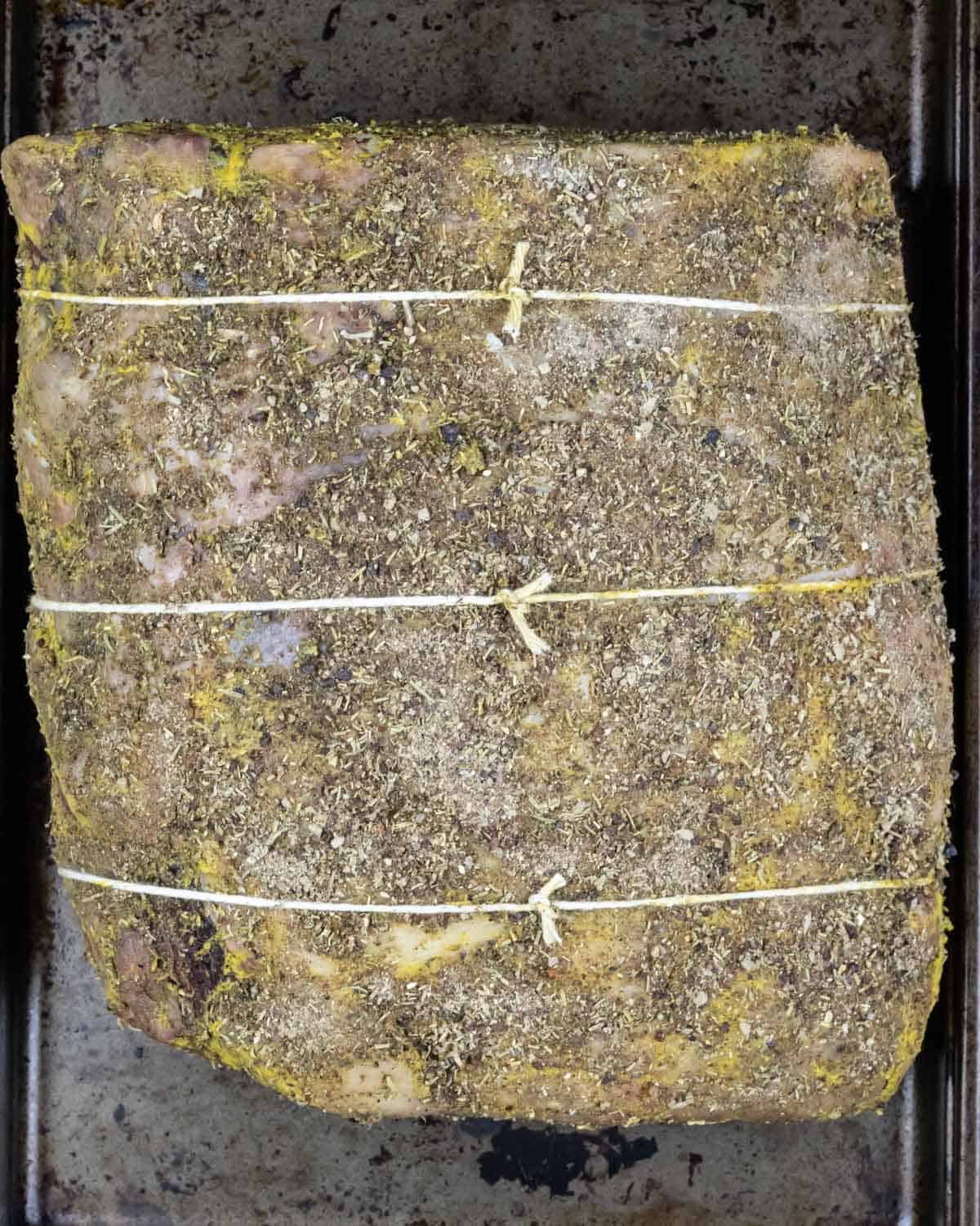 Seasoned roast tied with chef's string in three places